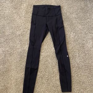 Lululemon yoga pants. Black. Size 4. Side pockets and waistband pockets.